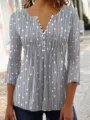 Detailed view showing the V-neck button detail and printed fabric of the gray top - S / Tops / Green