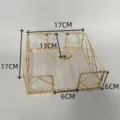 Gold metal napkin holder detail view showing dimensions and metal wire design structure. - 17*17*6 cm