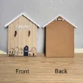 Front and back detail of a house-shaped wooden wall hook with Home text design - Home cabin-wood color / 21x17.5x3CM