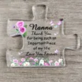 Heldere acryl plaquette in puzzelvorm met Nanna-bedanktekst en kleurrijke bloemen - Curve Q50 / Breedte Ongeveer 8cm Dikte 1cm / Oma Stijl (Nanna)