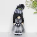 Detailed shot of a black plush autumn gnome holding a plaid pumpkin - Grey Plaid Pumpkin Gnome
