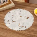 Close-up of white floral PVC placemat with intricate hollowed-out design on wooden table - Style B (Hollow Floral) / Silver