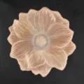 Detailed macro view showing the metallic texture of the champagne gold floral PVC placemat - Style D (Blooming Flower) / Rose Gold