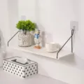 Large minimalist white wall-mounted wooden floating shelf with sleek black metal brackets - White Large 50cm