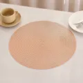 Close-up detail of elegant round PVC placemat showing its intricate woven gold texture - G款 (镂空编织) / Rose Gold