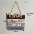 Rustic wooden wall hanging plaque with Love Makes The World Go Round slogan detail - 25x41x0.6cm / Love Style