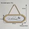 Detail view of wooden welcome sign showing dimensions and rustic rope hanger - 29.5x11.4cm / White Welcome Butterfly