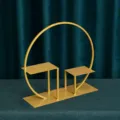 Modern gold iron dessert stand with circular frame for elegant wedding table decoration - Windowsill