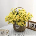 Detailed view of yellow artificial daisies set in a woven heart basket for home decor - Yellow