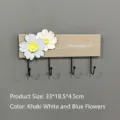 Modern wooden wall-mounted coat rack with floral decor and four black metal hooks - 4 Hooks / Khaki with White and Blue Flowers
