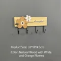Solid wood wall-mounted coat rack with floral decor and four metal hooks in natural finish - 4 Hooks / Natural Wood with White and Orange Flowers