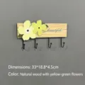 Simple solid wood wall-mounted coat rack with decorative yellow flowers and 4 black hooks - Natural Wood Yellow & Green