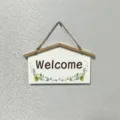 Handcrafted rustic wooden Welcome hanging sign with floral motifs and natural jute rope - Welcome