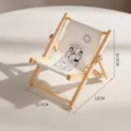 Miniature wooden folding beach chair phone stand featuring a cute cartoon illustration - Lifestyle Illustration Chair Phone Stand / 11.5x12x10.5cm / Love the Life You Live
