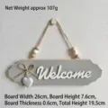 Rustic grey wooden welcome sign with hanging rope, beads, and white heart ornament. - 3D Letter with Heart / 26x7.6cm / Gray Welcome