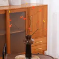 Premium artificial maple branches in a dark brown glass vase for aesthetic home decor - Red Maple