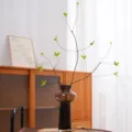 Realistic artificial green leaf branches in a stylish brown glass vase for home decor - Green Leaf
