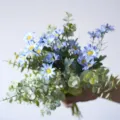 Vibrant artificial blue daisy bouquet mixed with green eucalyptus leaves for home decoration - Blue
