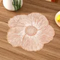 Close-up detail of a rose gold floral PVC placemat with elegant heat resistant texture - Style J (Floral Shape) / Rose Gold