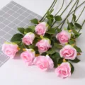 Detailed view of nine elegant pink artificial snow mountain roses with silk petals - Pink