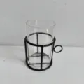 Minimalist cylindrical glass vase with a black iron frame holder for home decoration - Black