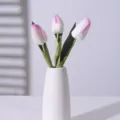 Realistic artificial pink and white tulips in a minimalist white ceramic vase with shadow - Purple Border