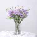 Elegant bouquet of purple artificial daisies in a glass vase for home and wedding decor - Purple