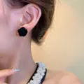 Elegant black velvet camellia stud earring worn by Asian model for detailed product view - Black Camellia Style (E3572) / Black