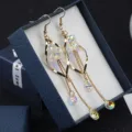 Long gold drop earrings featuring iridescent crystal floral design and chain fringe detail - Iridescent Crystal Tassel Style (E0272) / Gold