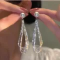 Elegant long tassel earrings featuring white pearls and sparkling rhinestones for women - Long Rhinestone Tassel Earrings (E3016 Silver) / Silver