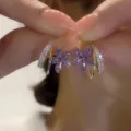 Elegant purple flower hoop earrings with sparkling cubic zirconia in a gold-plated finish. - Purple Flower Rhinestone Earrings (E3071) / Gold Purple