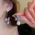 Elegant asymmetrical purple floral earrings with white faux pearls and silver wavy dangles - Asymmetric Gradient Flower Artificial Pearl Tassel Earrings (E3204) / Purple
