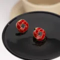 Elegant red enamel twist stud earrings with golden trim for women's fashion jewelry - Spiral Knot Stud Earrings (E3702) / Red
