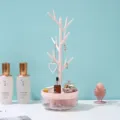 Présentoir à bijoux rotatif rose en forme d'arbre pour boucles d'oreilles et colliers. - Rose
