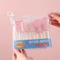 Pink and clear travel bottle set in a transparent pouch for toiletries and liquids. - 7+2 Set (9-Piece) / Light Pink