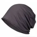 Dark grey cotton knit beanie hat featuring a stylish rolled edge and trendy slouchy fit. - Fits 56-60cm Head Circumference (Elastic) / Dark Gray