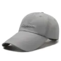 Lightweight grey baseball cap featuring an extended sun brim and California cursive embroidery - Fits 56-60cm / 刺绣多字母款(日字扣) / Light Gray