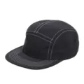 Modern black 5-panel skateboard cap featuring white contrast stitching and a flat brim. - Black + White Stitching