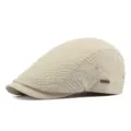 Beige jacquard textured flat cap with breathable fabric and a small metal logo detail - Fits 55-60cm Head Circumference / Light Beige