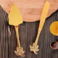 Vintage golden cake knife and server set with decorative palm leaf hollow handles - Coconut Tree Style