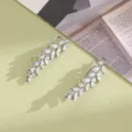 Macro detail of silver leaf earrings with sparkling marquise-cut cubic zirconia stones - Wheat Ear Hook Style (E3148) / Silver