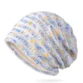 Berretto in maglia leggera da donna con motivo a righe blu e gialle e dettagli traforati - Blu