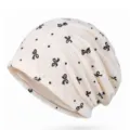Berretto in pizzo color crema traspirante con stampa di fiocchi neri per donna - Taglia Unica (55-60 cm) / Modello a fiocco / Beige