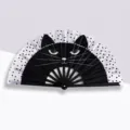 Foldable plastic hand fan featuring black cat face and white polka dot pattern - Shadow Cat