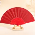 Abanico plegable rojo brillante de 7 pulgadas con varillas de plástico a juego - 7" / Rojo