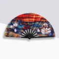 Folding Kung Fu fan with vibrant oil-painted water lily sunset design on black ribs - Water Lilies