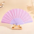 Ventaglio pieghevole rosa glitterato da 7 pollici con stecche in plastica viola su supporto - 7" / Viola chiaro