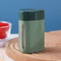 Green automatic press-type toothpick dispenser with transparent window on wood board - Dark Green