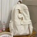 Minimalist Japanese cream plaid student backpack with a cute plush monster charm - With Spirit Pendant / White and Brown