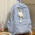 Stylish light blue plaid student backpack featuring a cute white fluffy charm accessory - With Spirit Pendant / Blue